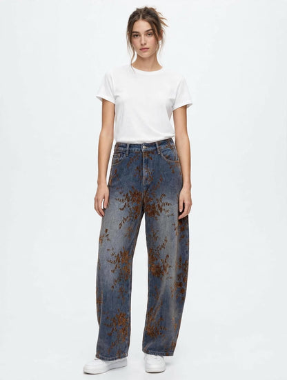 JEANS IN DENIM CON STAMPA FLOREALE MARRONE