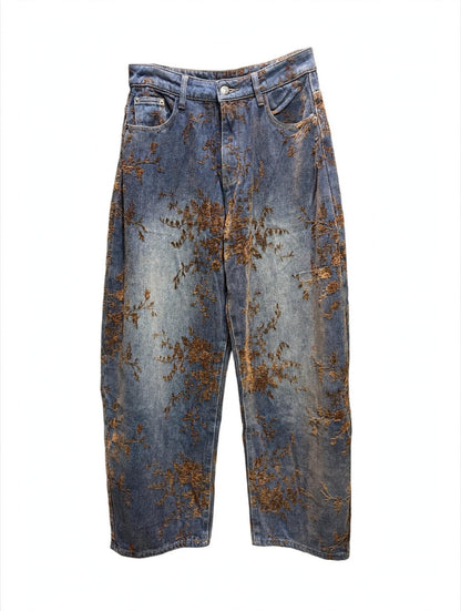 JEANS IN DENIM CON STAMPA FLOREALE MARRONE